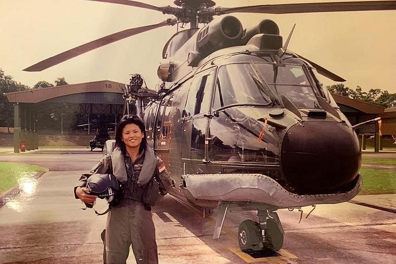 Ms Poh Li San, pictured with a Super Puma circa 2005, counts being deployed for humanitarian aid and disaster relief in the 2004 Boxing Day tsunami aftermath as one of the highlights of her air force career. Mr Robert Tan, seen on his last Super Puma