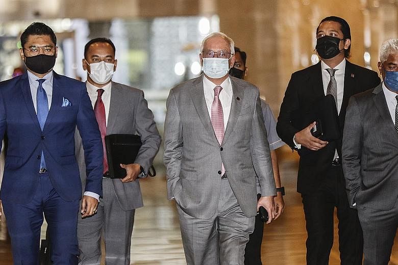 Najib Razak (centre) arriving at the Court of Appeal in Putrajaya yesterday. The Pekan MP remains free, pending his appeal. PHOTO: EPA-EFE