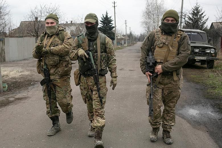 Ukrainian soldiers in the country's Donetsk region on Wednesday. If Russian sources are to be believed, Ukraine may be planning to either retake the Crimea peninsula, a Ukrainian territory Russia invaded and annexed in 2014, or overrun the two enclav