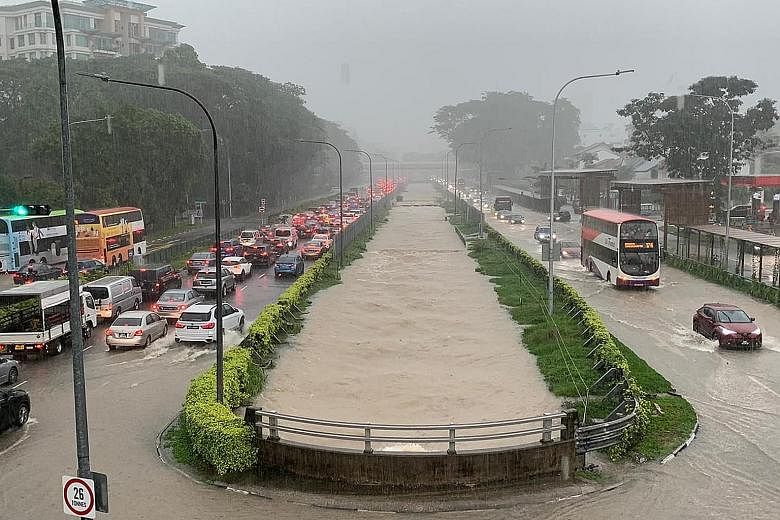 A flash flood along Bukit Timah Road and Dunearn Road yesterday. The prolonged heavy rain caused water levels in several drains and canals to exceed 90 per cent of their capacity. PHOTO: ROADS.SG/ FACEBOOK