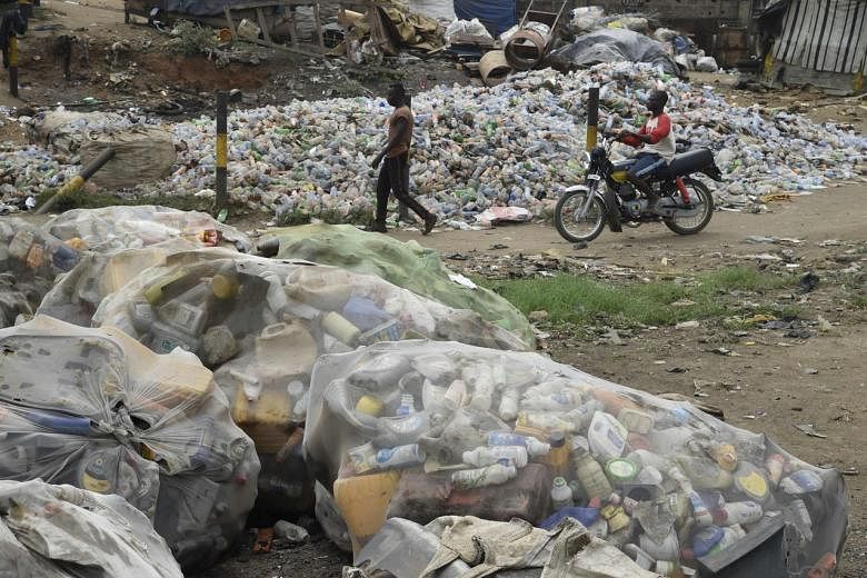 Nigerian teens create fashion from trash to fight pollution