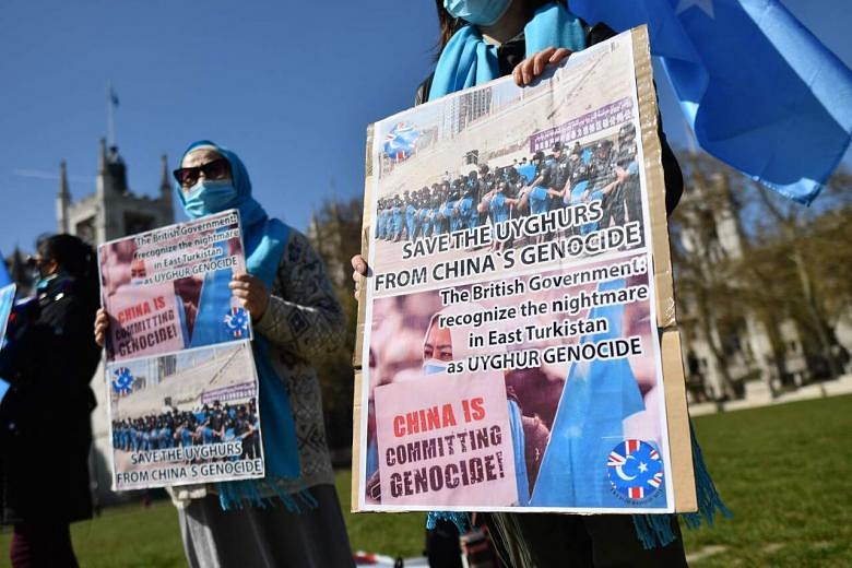 UK MPs Anger Beijing By Declaring 'genocide' In Xinjiang | The Straits ...