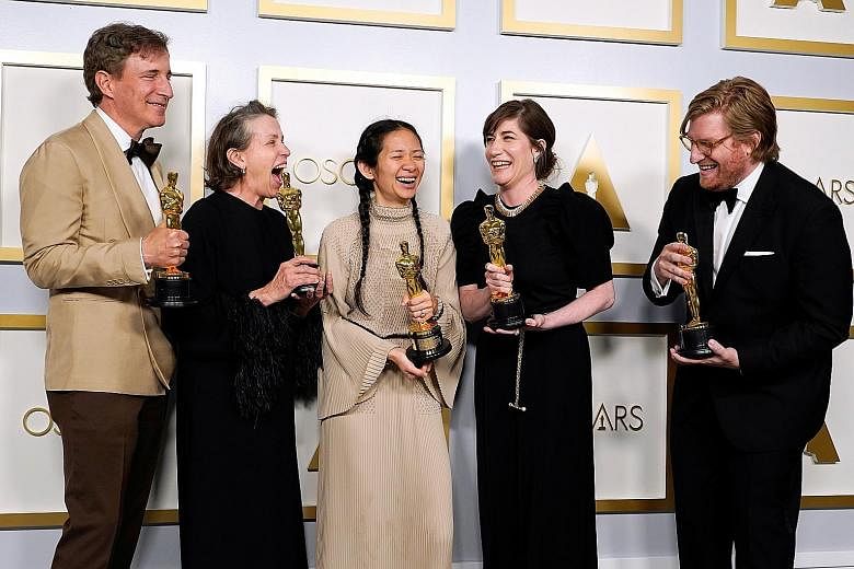 South Koreans watching in Seoul yesterday as the country's first Oscar winner for acting Youn Yuh-jung spoke at the Academy Awards. In her speech, the Best Supporting Actress winner gave a lesson on how to say her name correctly. Producers (from left