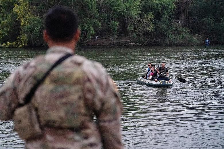 Above: A Covid-19 vaccination site in Mississippi on Tuesday. In a recent poll, people were more optimistic about defeating Covid-19 than they were in January. Right: Asylum seekers crossing the Rio Grande river into the US from Mexico on Tuesday. Pr