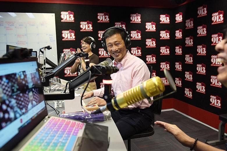 Transport Minister Ong Ye Kung with presenters Angelique Nicolette Teo and Glenn Ong yesterday during an interview at the One FM 91.3 studio. Among the topics covered in the interview were the minister's experiences in the Education and Transport min