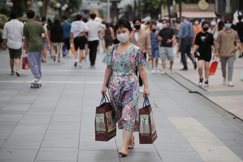 Consumer spending by residents last year was comparable with what it was in 2019 despite the pandemic, most likely because people were spending in Singapore instead of overseas, said the Monetary Authority of Singapore, ST PHOTO: GIN TAY