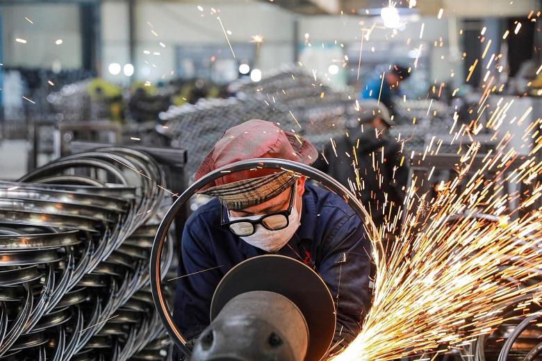 A factory worker in Hangzhou, in China's eastern Zhejiang province. China's economic recovery quickened sharply in the first quarter of the year with record growth of 18.3 per cent, shaking off the hit from last year's slump induced by the Covid-19 p