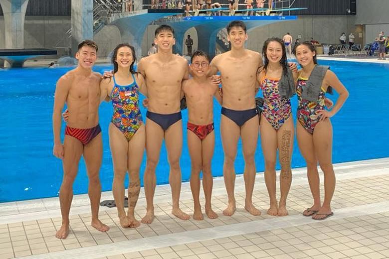 Above: Team Singapore divers at their training session held at the Tokyo Aquatics Centre ahead of the May 1-6 Fina Diving World Cup. Left: The divers keep their distance and their masks on even when they are stretching during training.