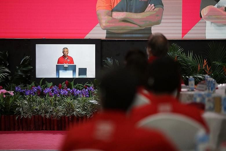 Prime Minister Lee Hsien Loong seen here delivering his keynote address to unionists at D'Marquee@Downtown East during the hybrid May Day Rally yesterday.
