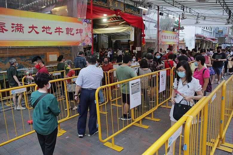 Devotees queuing to enter Kwan Im Thong Hood Cho Temple in Waterloo Street on Feb 15 after it closed on Chinese New Year's Eve a few days earlier to prevent crowding. The temple will be closed on Vesak Day on May 26.