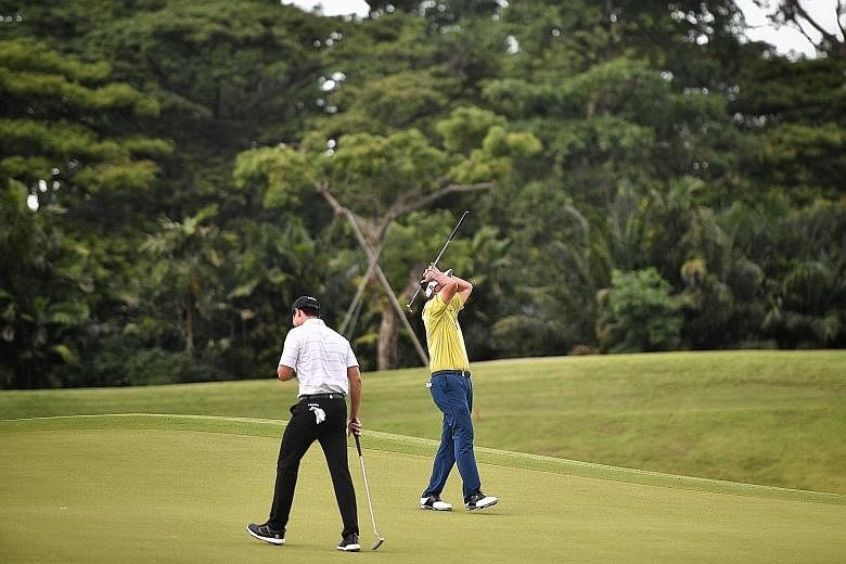 Left: Gregory Foo (in white and above) and Mardan Mamat during the final round of the Singapore Pro Series Invitational yesterday. Foo shot his best-ever score of eight-under 64 for a 139 total to beat childhood hero Mardan by two shots and clinch th