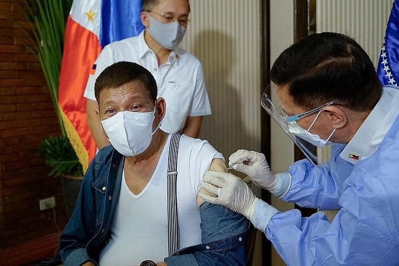 Philippine President Rodrigo Duterte receiving a dose of China's Sinopharm vaccine on Monday.