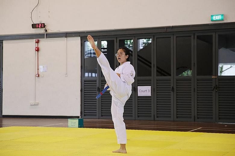 Tampines Meridian Junior College's Zhang Yani competing during the Schools National A Division taekwondo (poomsae) competition at the Ministry of Education headquarters at Mount Sinai yesterday.