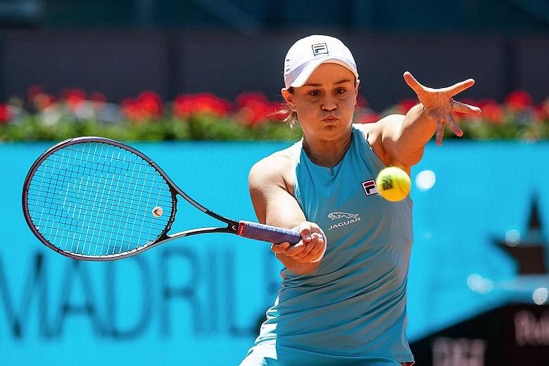 World No. 1 Ashleigh Barty making a return to Czech Petra Kvitova during their quarter-final clash at the Madrid Open yesterday. The Australian, chasing her fourth title of the year, won in three sets.