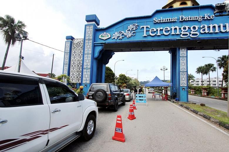 A roadblock at the Pahang-Terengganu border on April 15. The fresh MCO includes curbs such as banning dine-ins, with food prepared only for delivery and takeaways. With inter-state travel banned since January, people separated in different states hav