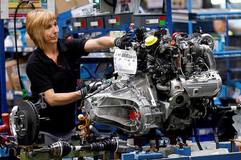 An employee working on an engine at a Nissan factory near Barcelona. The car sector's predicament in relation to the chip shortage dates back to poor planning during the pandemic and limited chipmaking capacity, but it has been compounded by shrinkin