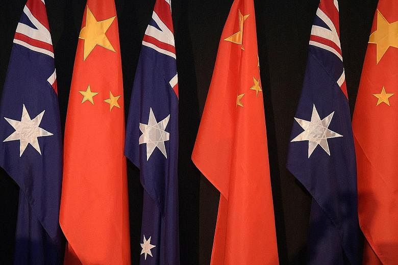National flags of China and Australia. Trade and investment between the two countries can take place in the absence of dialogue, but Beijing can also take more action against Canberra, says an expert.