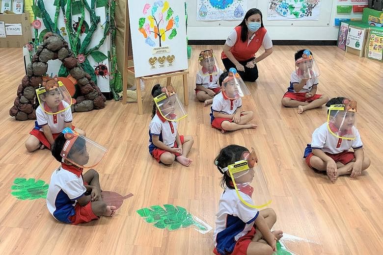 Children at a PCF Sparkletots branch participating in a showcase during yesterday's launch of the Temasek Foundation First Step Programme. The programme aims to provide financial help to lower-income families in order to reduce the barriers to pre-sc