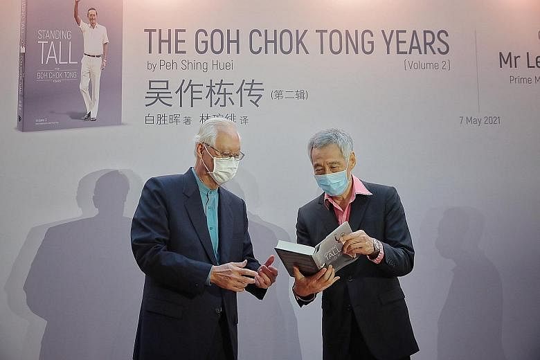 Above: Emeritus Senior Minister Goh Chok Tong (left) with Prime Minister Lee Hsien Loong at the launch of Standing Tall at the National Gallery Singapore yesterday. Below: Standing Tall takes a thematic approach to detailing key moments in Mr Goh's c