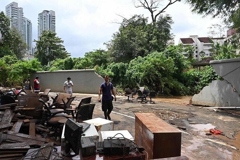 Furniture put out to dry next to a wall where the Krukut River in Jakarta broke through and caused flooding in February. The sinking Indonesian capital topped the ranking of cities most vulnerable to environmental hazards.