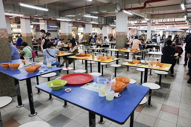 Tables left uncleared at People's Park Food Centre last month, despite efforts to change diners' behaviour at public places. ST PHOTO: ONG WEE JIN