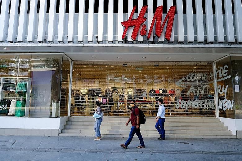 The area near the Saloma Link bridge was almost deserted during the nationwide movement control order in Kuala Lumpur on Wednesday. Top: An H&M store closed during the national movement control order (MCO) in Kuala Lumpur on Wednesday. The country ha
