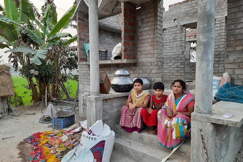 Above: Widow Bina Mondal, who works as a daily wage worker on Satjelia island to support herself and her two daughters, is contemplating working in Kolkata.
