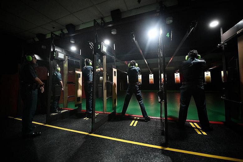 Certis officers at its indoor shooting range. Certis says it monitors the discipline, mental, physical and financial well-being of its auxiliary police officers closely.