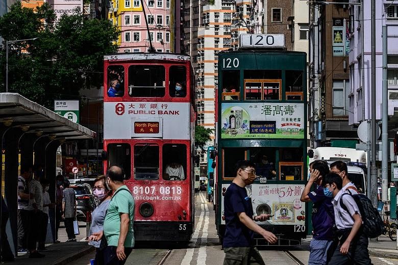 There are specific challenges facing small economies such as Hong Kong (above) and Singapore that have positioned themselves as global hubs for people, capital and companies, says the writer. They will need to strengthen positions of competitive adva
