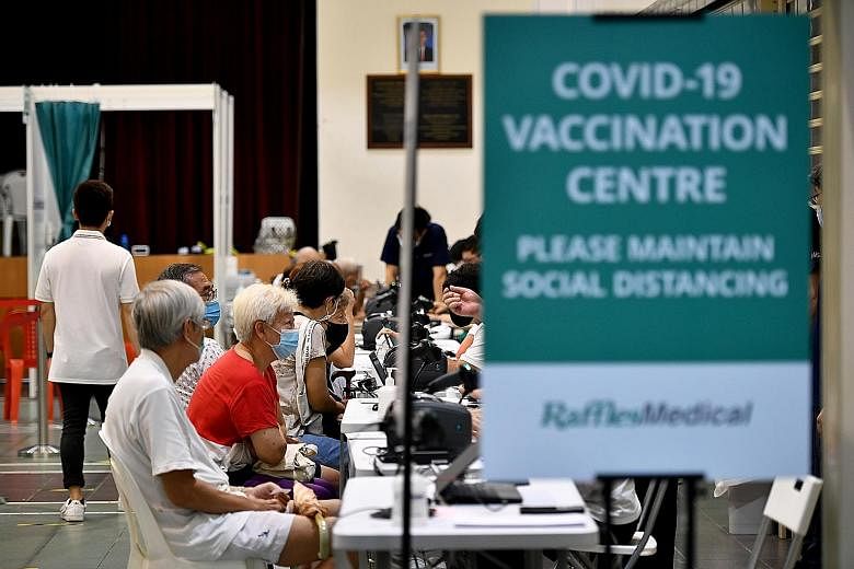 Seniors getting vaccinated in March. Singapore's moderately high vaccination rate of over 30 per cent of the population is a game changer in helping the nation avoid another circuit breaker, says Professor Dale Fisher. ST PHOTO: LIM YAOHUI