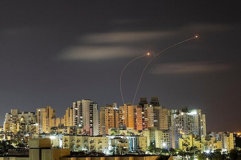 Streaks of light from Israel's Iron Dome anti-missile system as it intercepts rockets launched from the Gaza Strip towards Israel. In many respects, what the latest bout of fighting has achieved is to deepen the political impasse in the region, says 