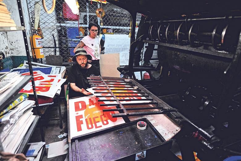 Founded to print newspapers, the press (above) also produced concert posters for artistes such as British singer Elton John. Today, it prints urban art such as those by Colombian artists Tonra (far left) and Lili Cuca (left). Mr Jaime Garcia, one of 