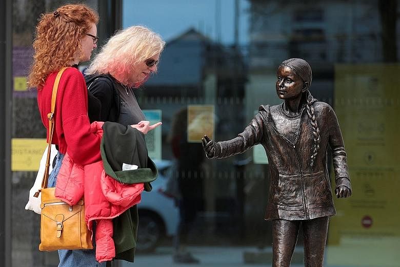 A statue of Ms Greta Thunberg at Winchester University in Britain. The climate activist aims to change how the world produces and consumes food in order to counteract the threats of carbon emissions, disease outbreaks and animal suffering. PHOTO: REU