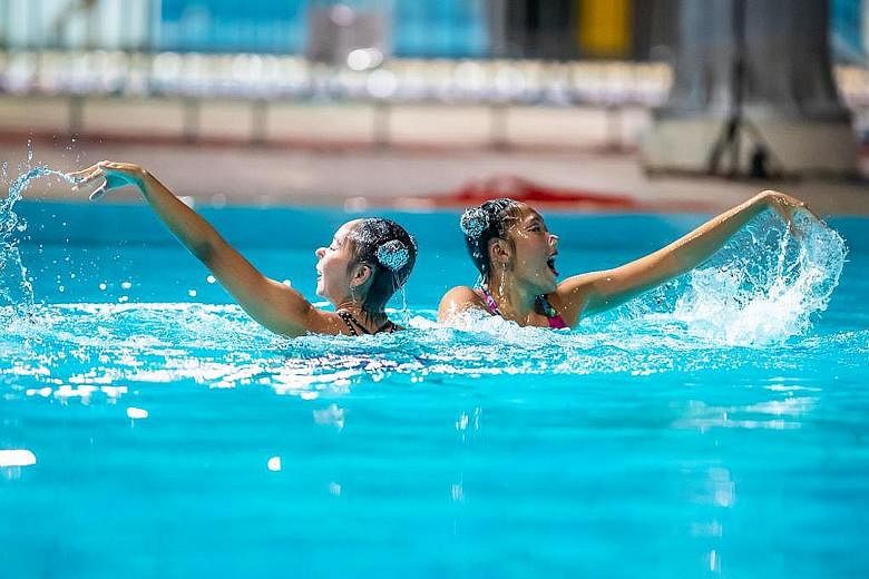 Miya Yong (left) and Debbie Soh performing a routine during a closed-door performance at Toa Payoh Swimming Complex earlier this year.