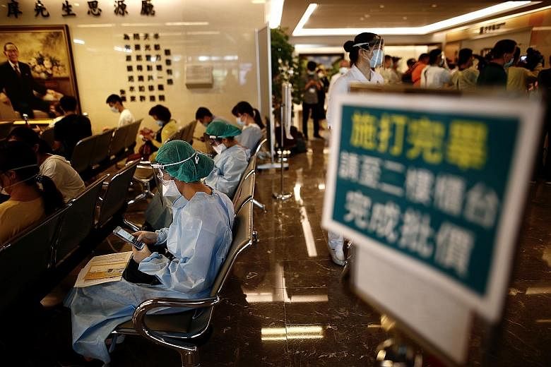 Front-line medical workers resting after getting the Oxford-AstraZeneca Covid-19 vaccine at a hospital in New Taipei, Taiwan, last week. PHOTO: EPA-EFE