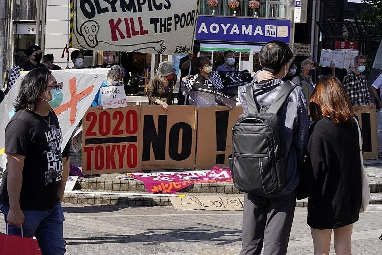 Residents protesting against the Olympic Games in Shinjuku, in Tokyo. The mood is overwhelmingly negative among media outlets and businesses, as well as the Japanese public. PHOTO: EPA-EFE