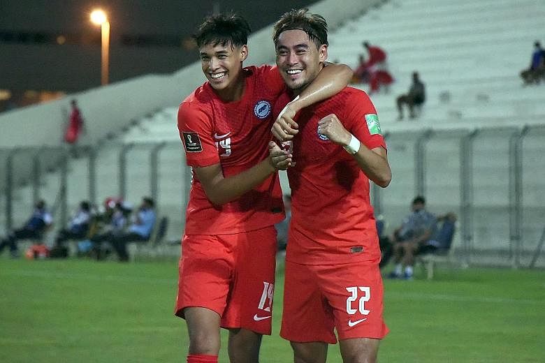 Midfielder Yasir Hanapi (far left) wearing the armband in Singapore's 1-1 draw with Afghanistan in a training match on Saturday in the absence of Hariss Harun. The Lions led through Gabriel Quak's (above) first-half strike but conceded with virtually