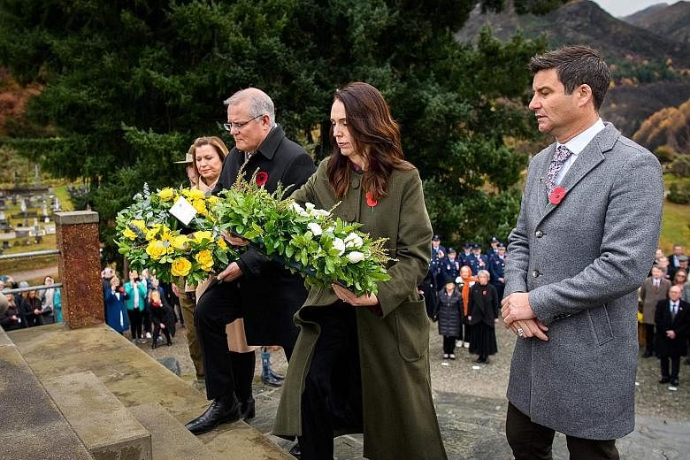New Zealand Prime Minister Jacinda Ardern and her Australian counterpart Scott Morrison laying wreaths at Arrowtown War Memorial in Queenstown yesterday. China dominated the Queenstown conference by the two leaders, who cited developments in Hong Kon