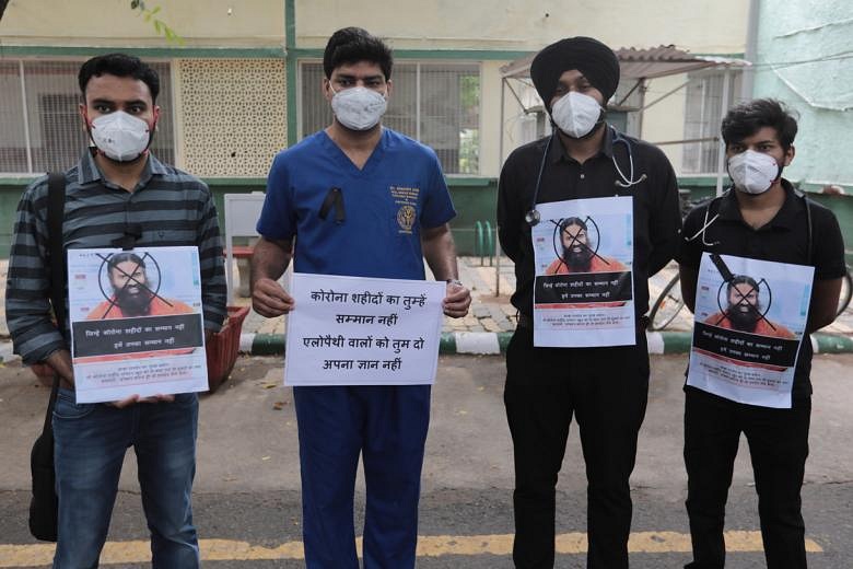 Indian doctors protest against 'yoga-beats-Covid' guru | The Straits Times