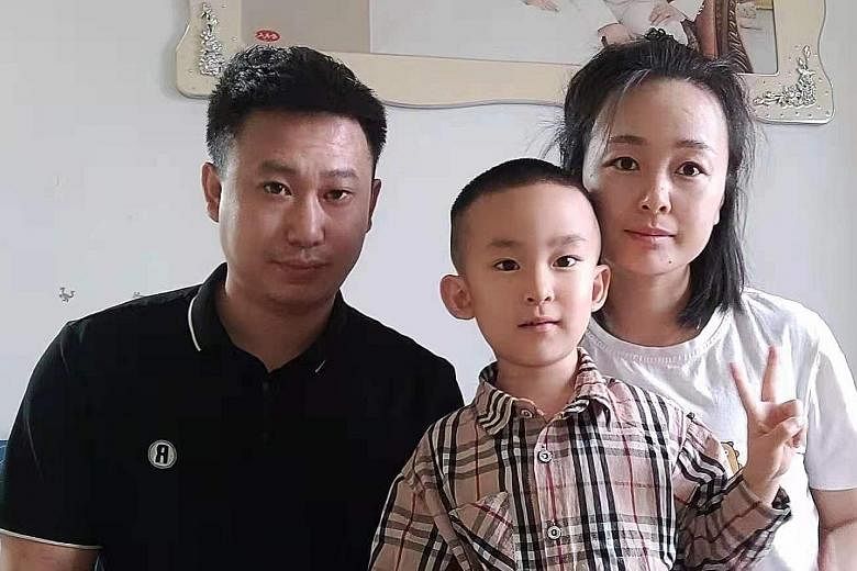 Ms Li Ji with her husband Lv Yue Feng, both 34, and their only child, five-year-old Lv Yi Ming. The couple are not planning to have another child despite the policy change, citing financial concerns.