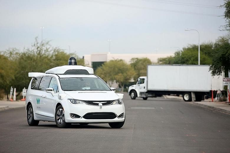 A 2018 photo of a Waymo Chrysler Pacifica Hybrid self-driving vehicle in Chandler, Arizona. Waymo is also building a new version of its self-driving technology that it will eventually deploy in other geographies and other kinds of vehicles, including