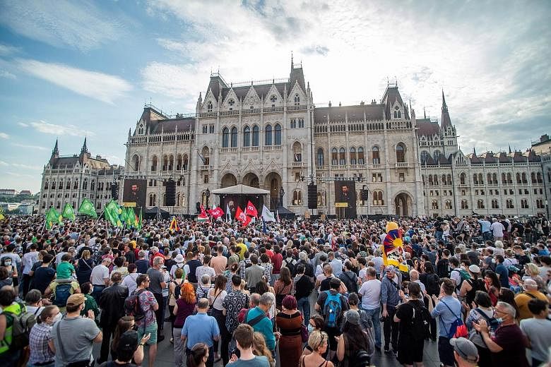 People protesting outside Parliament in Budapest last Saturday. They say the Fudan University project reflects the PM's disregard for democratic values. PHOTO: EPA-EFE