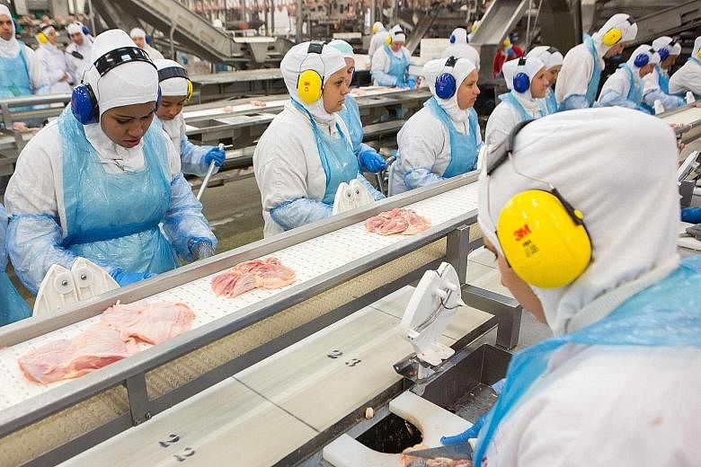 The JBS-Friboi chicken processing plant in Brazil in a 2017 photo. JBS plays a central role in supplying food to a great chunk of the globe's increasingly carnivorous population.