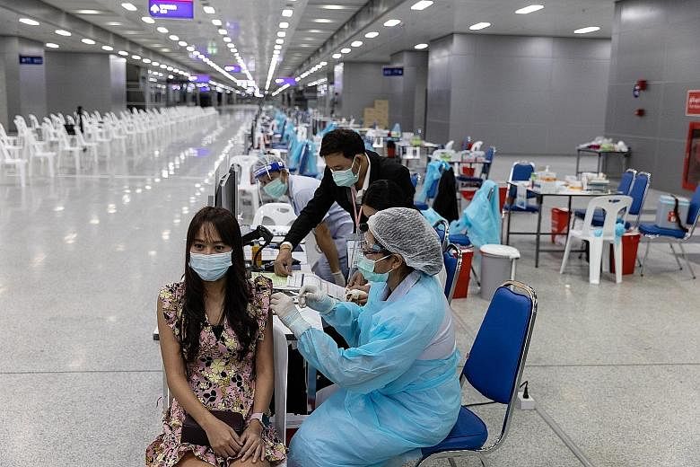 A health worker administering a dose of the Sinovac Covid-19 vaccine at a vaccination centre at Bang Sue Grand Station in Bangkok yesterday. Associate Professor David Lye of Singapore's National Centre for Infectious Diseases said that although Sinov