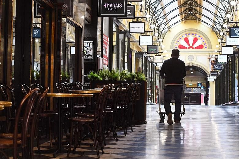 Empty chairs and tables in Melbourne's normally bustling city centre last Friday. The city's lockdown will be eased tomorrow but residents cannot visit other homes and must limit outdoor gatherings to 10 people.