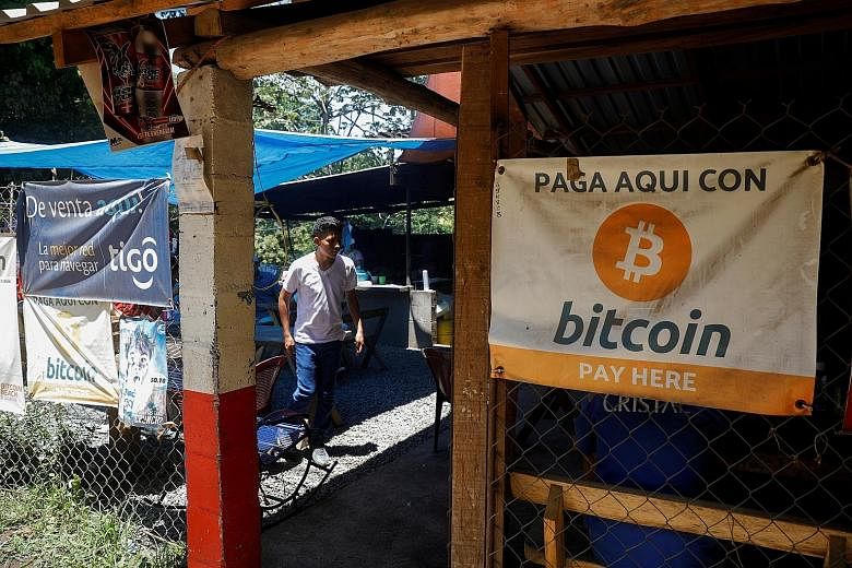 A Bitcoin banner at a eatery in Chiltiupan, El Salvador. While many regulators have criticised the growth of cryptocurrencies, their transparent transactions can work against lawbreakers.