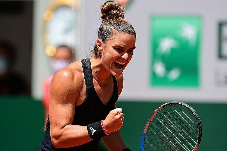 Greece's Maria Sakkari reacts during her women's singles quarter-final against defending champion Iga Swiatek of Poland at the French Open. She will play Czech Barbora Krejcikova in today's semi-final.