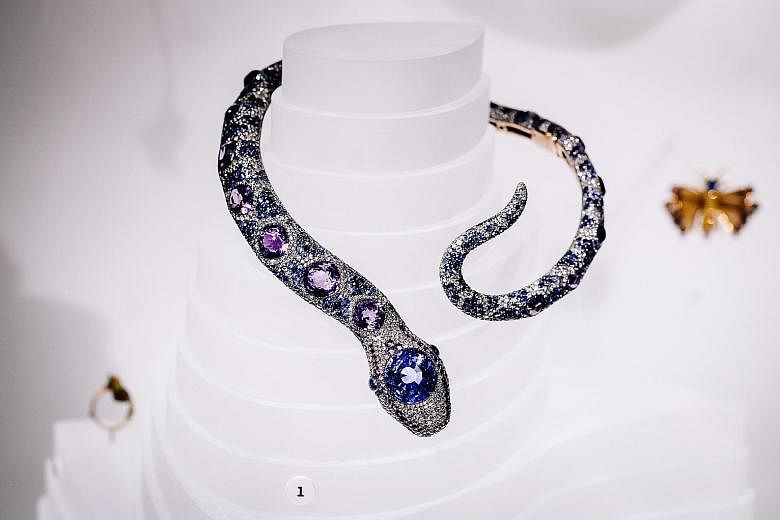 A snake necklace (above) by Cartier Paris from 1968 and a pelican cuff (left) by Bina Goenka from 2009 at the Beautiful Creatures exhibition. Sea animal-themed jewellery (left) is part of a special exhibition at the American Museum of Natural History