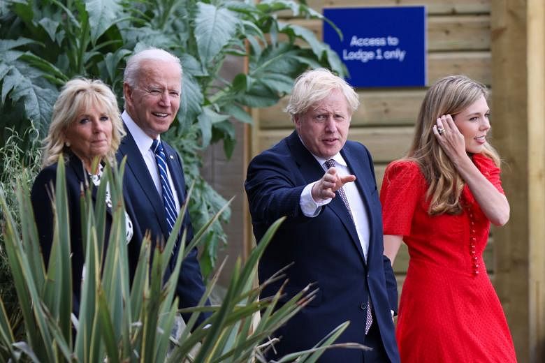 US President Joe Biden and his wife Jill with British Prime Minister Boris Johnson and his wife Carrie at the seaside resort of Carbis Bay in Cornwall, south-west England, on Thursday. Mr Biden, Mr Johnson and other Group of Seven leaders met at the 
