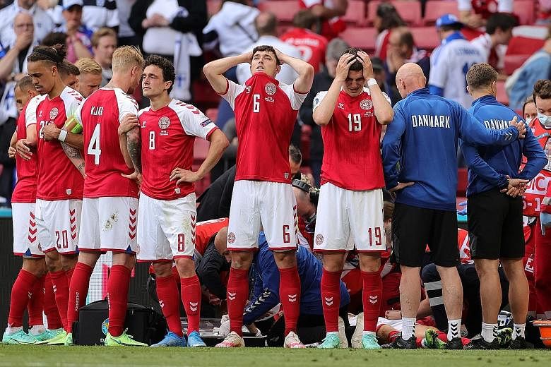 Denmark's players were distraught while Christian Eriksen received medical treatment during Saturday's Euro 2020 match against Finland.